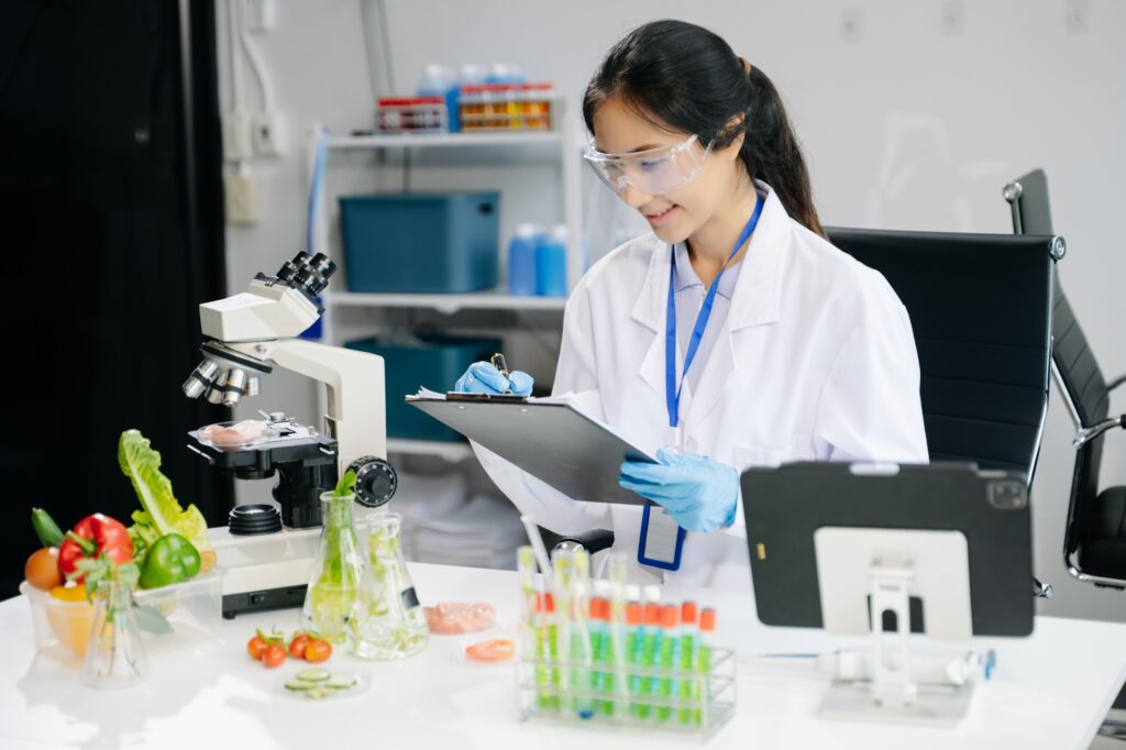 Food science as lab scientists test and analyze vegetables for safety